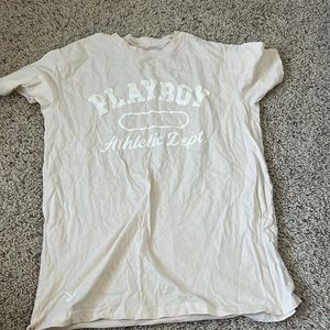 oversized cream colored with white lettering playboy tee